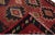 Beautiful vintage Turkish Kilim hand-knotted wool rug with a red field. This piece has a black frame and multicolor...