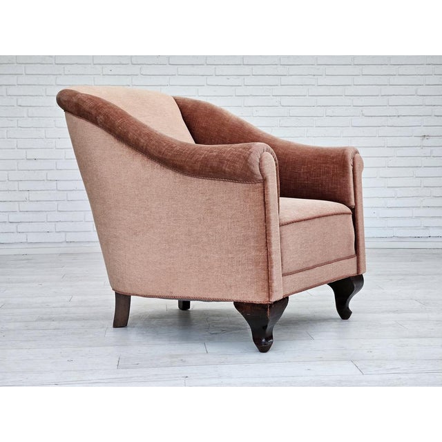 1960s, Danish lounge chair. Salmon pink furniture velour, brass springs in the seat, ash wood legs. Very good condition:...