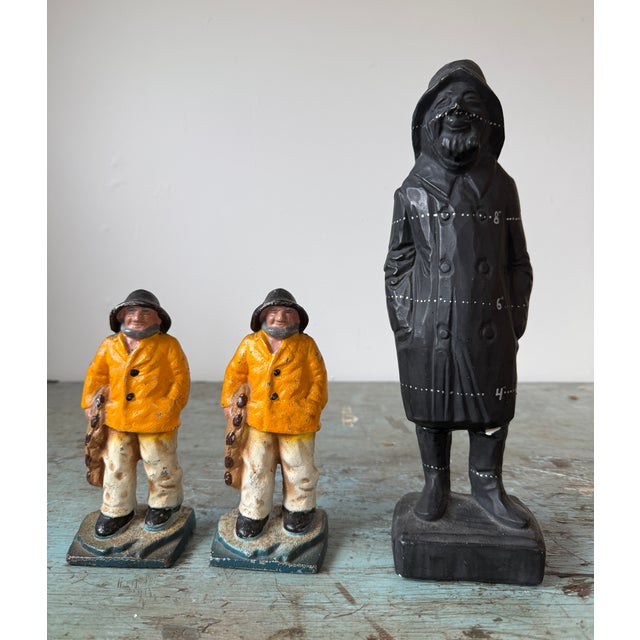 Pair of these classic vintage Fisherman in their Yellow Slickers, standing in frothy water. They appear ready to serve as...
