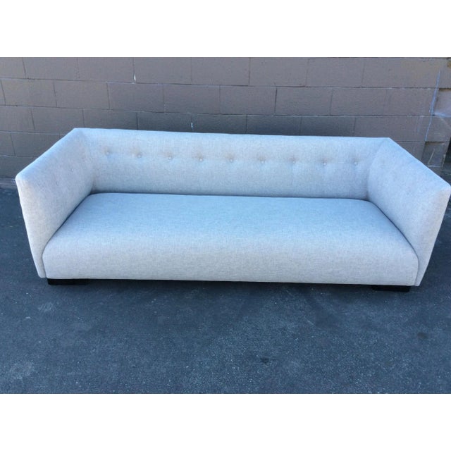 A beautiful custom made sofa in a light gray heavy cotton linen-like fabric. The color of the fabric changes depending on...