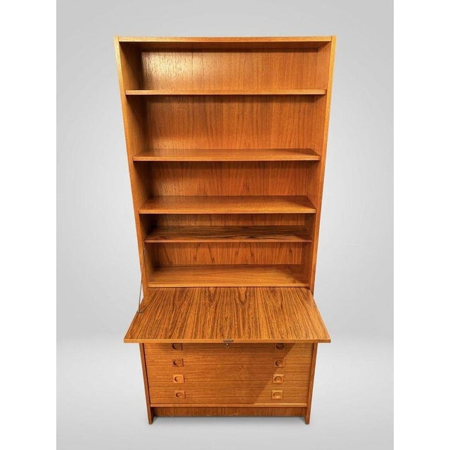 An exceptional 1970s Danish teak wall unit attributed to Sejling Skabe, combining minimalist Scandinavian design with...