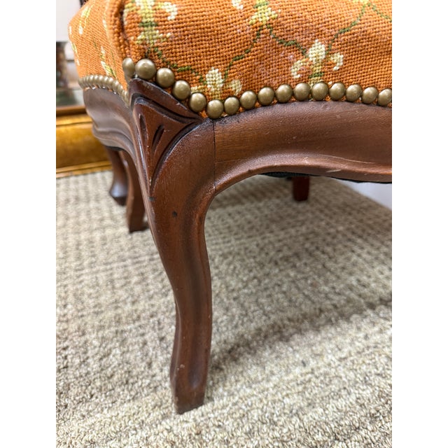 This is a vintage French beauty in a tangerine color with fleur de lis fine needlepoint. It is solid with nice nailhead...