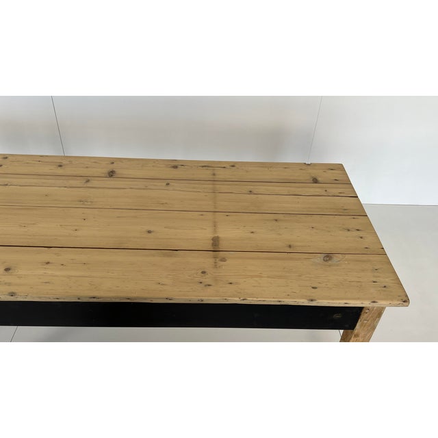 Large country-style table from a French farmhouse with a lacquered metal trim (3mm) on the long sides. The table is ideal...