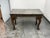Design Plus Gallery presents an Antique Carved Wood Marble-Top Center Table. The rectangular marble slab displays a...