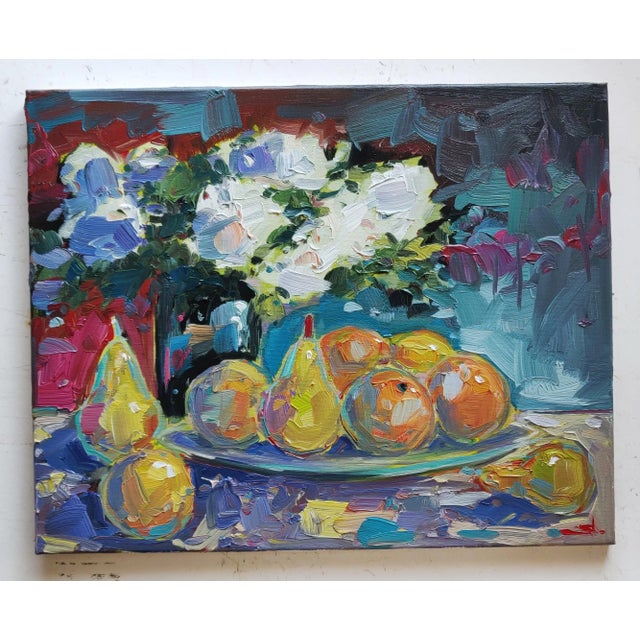 An impressionist oil painting of a bowl of fruit and white flowers, by UK based artist Vivek Mandalia. Frame and hang in...