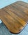 This is a handsome antique 1920s Colonial Revival gateleg drop leaf dining table crafted from solid maple. It features...