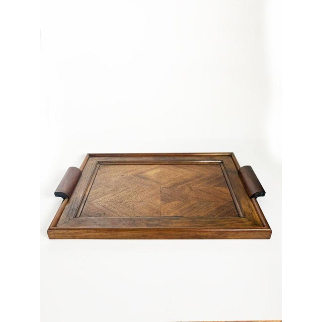 Elegant French serving tray dating from the 1940s, crafted in warm-toned wood with a decorative geometric veneer pattern...