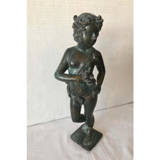 A good casting of a youth carving a torch. A fine Grand Tour piece.