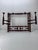 This spindle style rack is carved of solid walnut. There are 2 swinging hat pegs and 4 moving pegs for coats &...