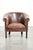 This lovely sheepskin club armchair features a beautiful patina, a subtle size, and a vintage appearance. It has a fixed...