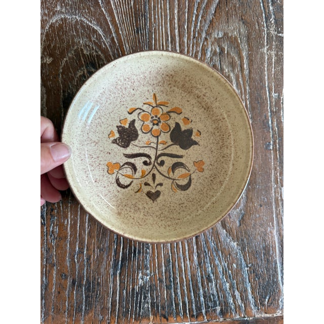 Set of three (3) vintage Red Wing Turtle Dove stoneware bowls featuring the pattern’s distinctive folk-art-inspired floral...