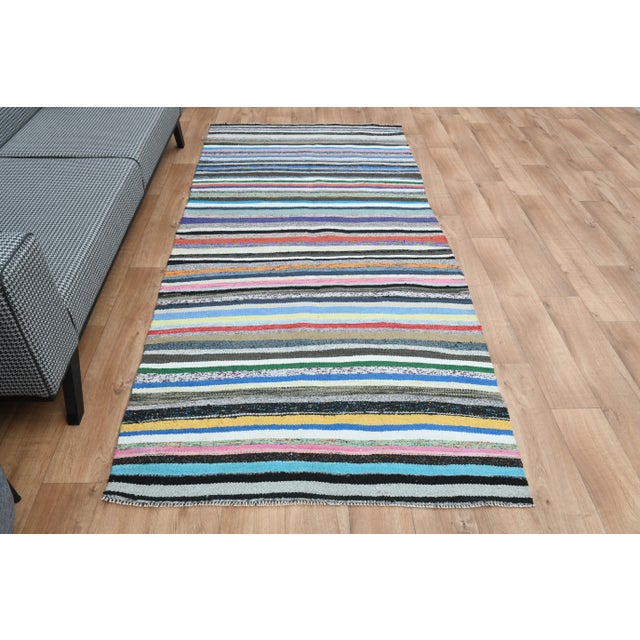 Vintage Turkish Hand-Knotted vintage rug is a semi-antique vintage area rug. The '70s Eastern region of Turkey's unique...