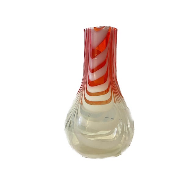 A striking study in fluid motion and vibrant color, this large-scale art glass vase showcases the timeless fenicio...