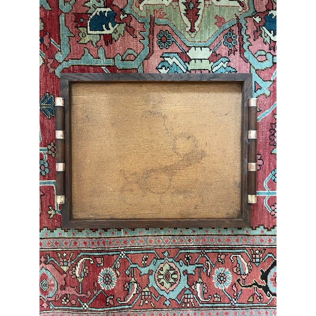 This is a fantastic wooden serving tray in an Arts and Crafts style. The interior base is cork and the rounded handles...