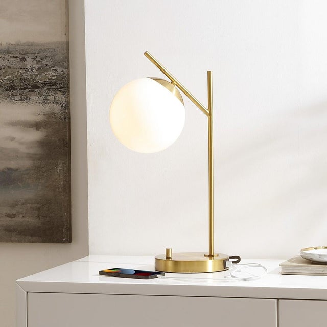 Elevate your space with the Suna table lamp. Standing at 20.5 inches, this lamp blends elegance and functionality in one...