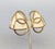 Late 1980s or early 1990s Modernist goldtone rounded triangles with ivory enamel with two goldtone circles going through...