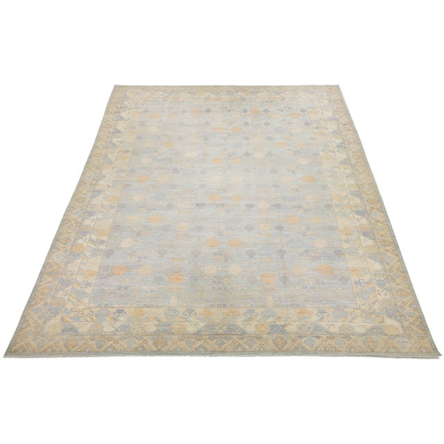 Enhance your space with this stunning Modern Khotan-style rug, hand-knotted from premium wool. Inspired by antique...