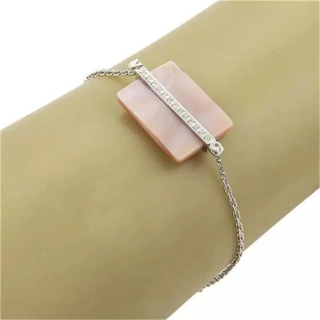 Material: 18k white gold Hallmark: Victoria Casal 750 Measurement: 7" long Center charm: 28.5mm long x 15mm wide Stones:...
