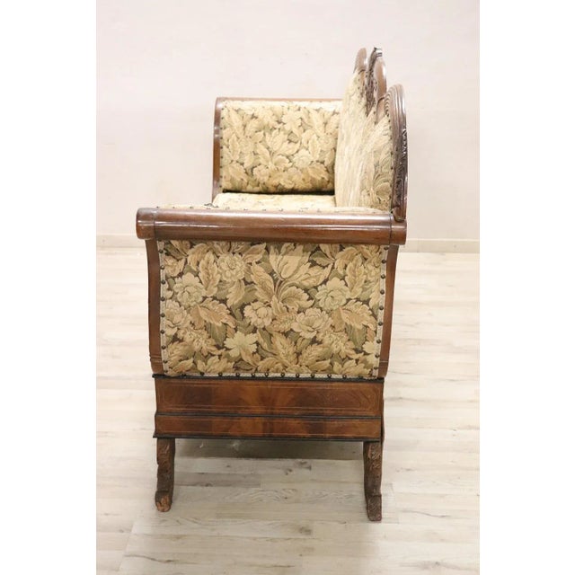 Antique settee 1825s in full Charles X era. The settee is made of solid walnut hand carved. Particular shape called a...