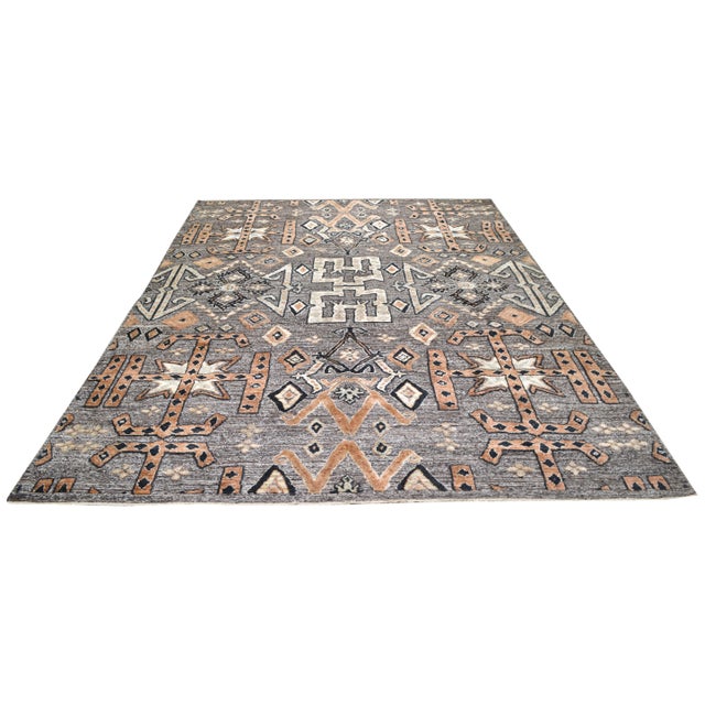 Hand-knotted with care using traditional rug making techniques, this wool rug blends timeless craftsmanship with a modern...