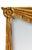A large and striking giltwood Italian wall mirror featuring a finely carved drapery motif. A swag trimmed in fringe spans...