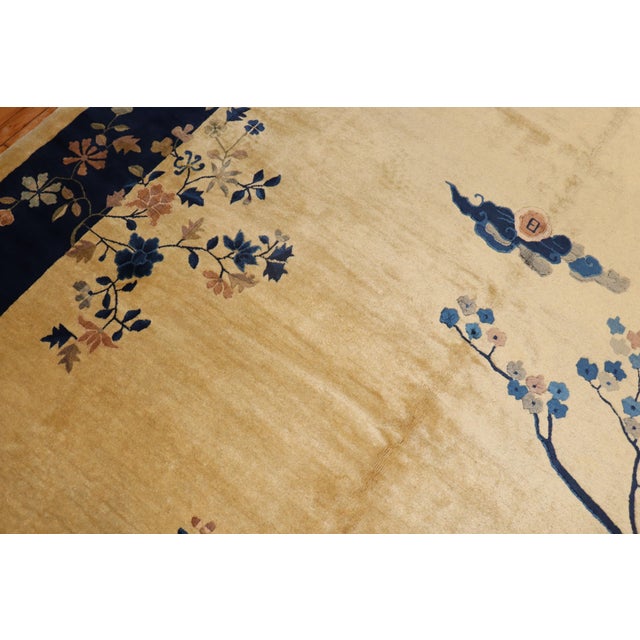 Full Pile Chinese Room size Pictorial rug from the 2nd quarter of the 20th century predominantly in beige and navy blue...