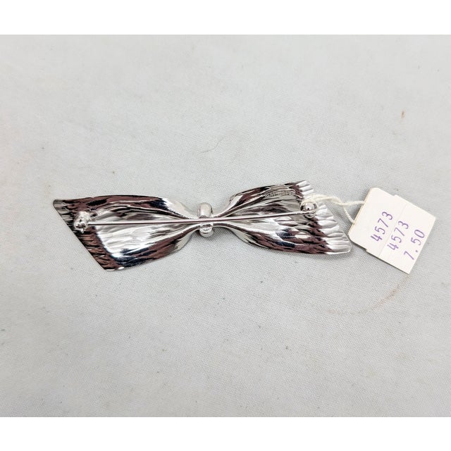 Metal Vintage C1976 Signed Napier Rhodium Plated Wavy Bow Brooch For Sale - Image 7 of 8