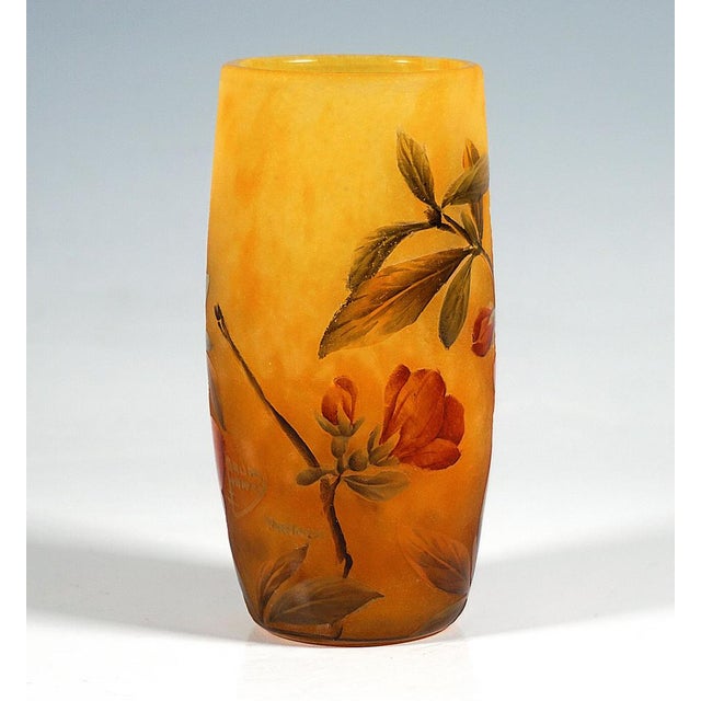 Cylindrical vase, colourless glass with flaky white and delicate red inclusions, yellowish and green powder inclusions in...