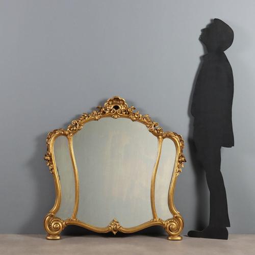 Period mirror, carved and gilded. The central mirror and two side mirrors are enclosed in molded frames enriched with leaf...