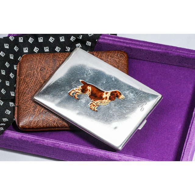 Embrace the elegance of a bygone era with this exquisite antique sterling silver cigarette case crafted by The Thomae Co....