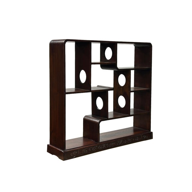 This elegant tabletop display stand is crafted from rich, dark-stained wood, featuring a sophisticated asymmetrical...