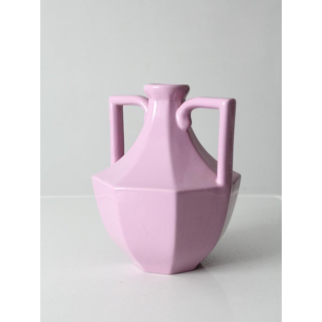 Striking vintage 1980s ceramic vase rendered in a luminous glossy lavender glaze. The boldly faceted form, flared neck,...