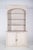 Bookcase with two doors, painted white. Composed of two parts, a lower part with a double-door cupboard and an upper part...