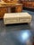 Elegance and sophistication are the key elements of this Italian glass and brass coffee table. The combination of sleek...