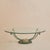 A French oval coffee table from the 1980s with a beveled glass top appearing to float above a sculptural iron and bronze...