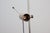 Pair of floor lamps by Tito Agnoli for Oluce (Model No. 387), made of nickel-plated metal with a travertine base. Tito...