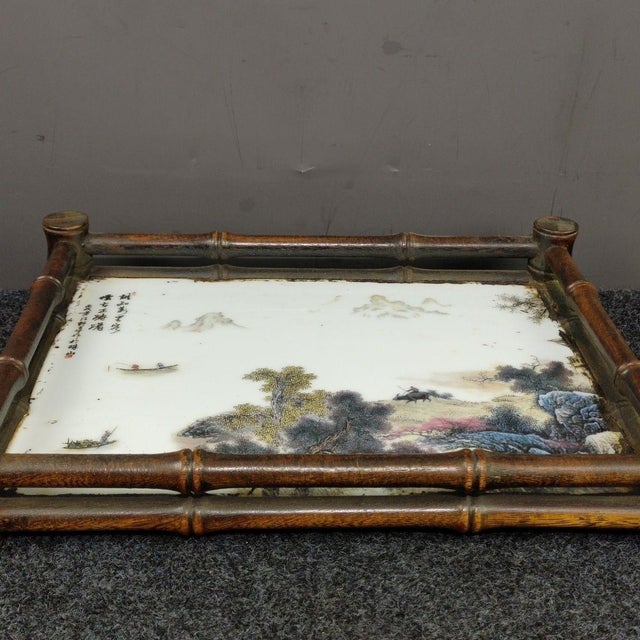 This elegant rectangular serving or tea tray features a striking juxtaposition of materials. The center is inset with a...