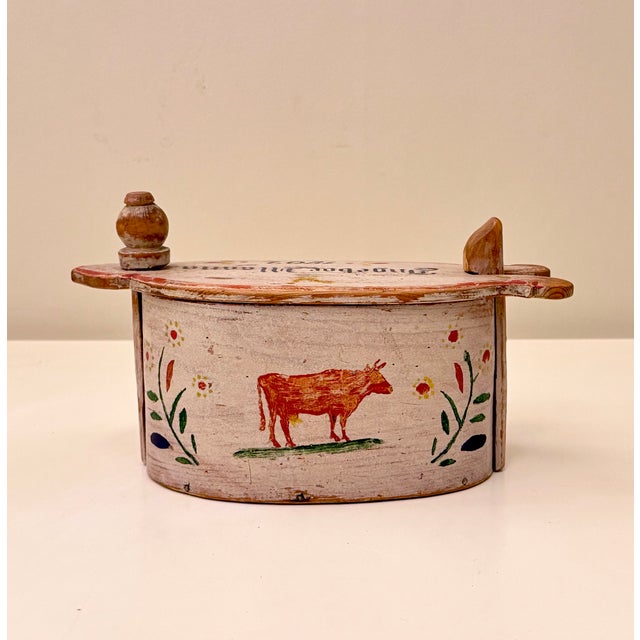 An antique Norwegian wooden tine box, hand-painted and dated 1902, representing a traditional form of Scandinavian folk...