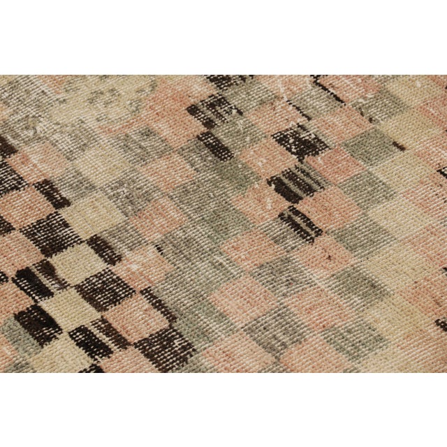 Hand-knotted in wool and originating from Turkey circa 1960 – 1970, this 2x6 vintage Zeki Müren runner is a unique...