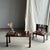 Small bench with a carved backrest featuring a rosette and scroll motif. A small piece of children's furniture, second-...