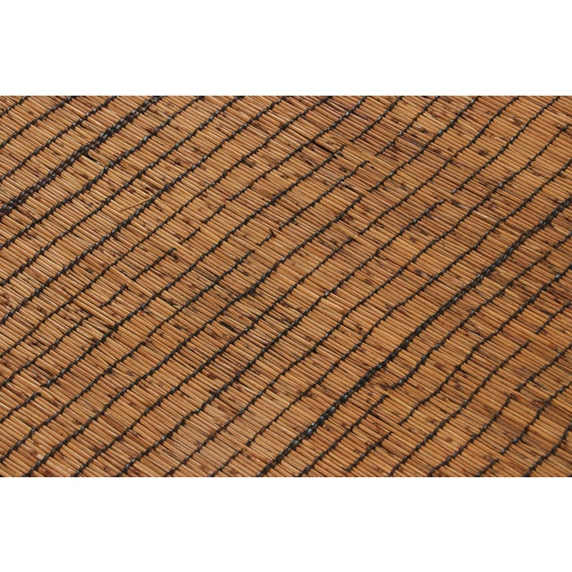 This vintage rug and floor covering is a 3x12 Tuareg runner mat from the nomadic tribe of the same name. Handwoven with...