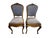 Pair of Louis XV style side chairs featuring hand-carved floral crests, graceful cabriole legs, and upholstered backs and...