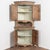 19th-century Swedish pine corner cabinet with curved bowfront form, built in 2 sections for easier transportation and...