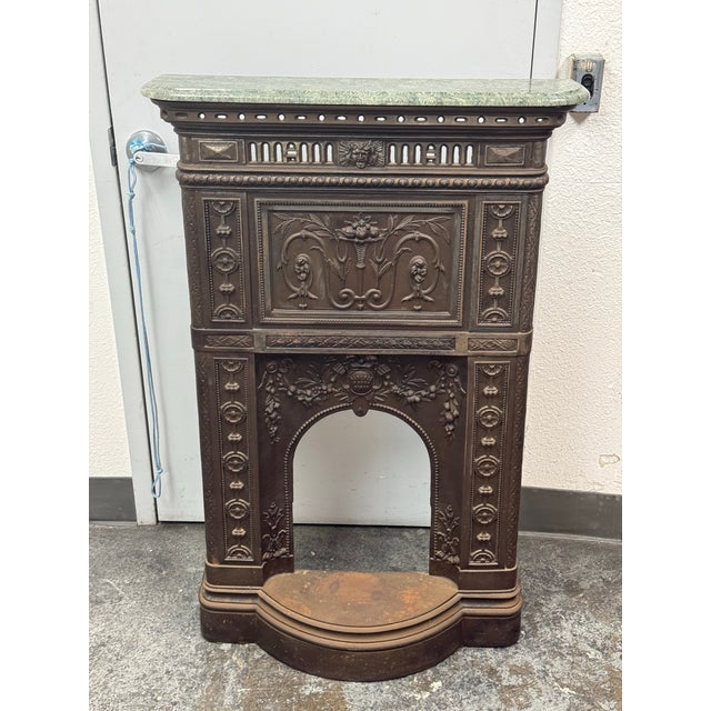 Design Plus Gallery presents a Cast Iron Fireplace Surround + Green Stone Top from the Victorian Era. This ornate...