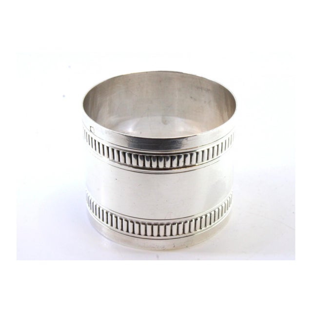 Silver Napkin Ring with Raised Edge Friezes, in Good conditions.