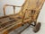 Set of two movable bamboo and rattan garden lounge chairs with wooden wheels, inspired by Italian Riviera leisure...