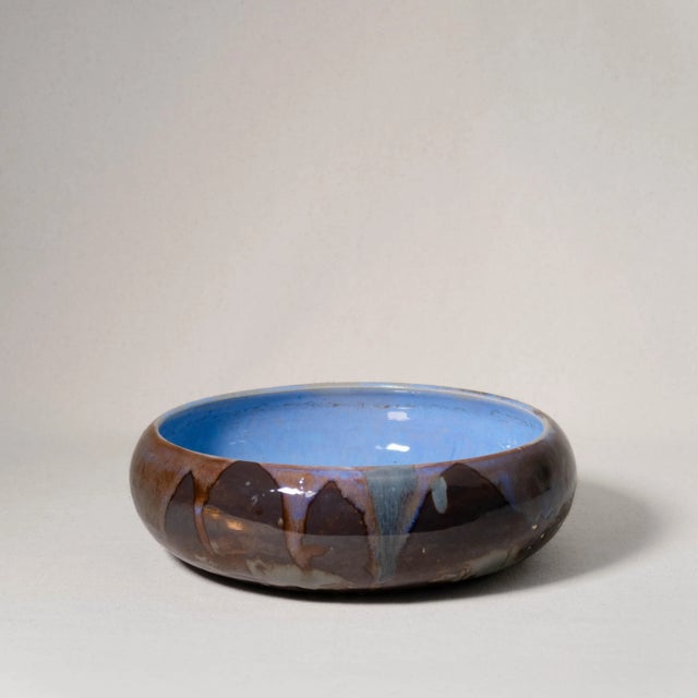 Vintage Handmade Studio Ceramic Drippy Blue and Brown Glazed Bowl This ceramic bowl features a shallow, rounded form with...