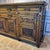 British Aesthetic period oak sideboard. Hand carved motifs including paterae, shells, and stylized florals. One lower...