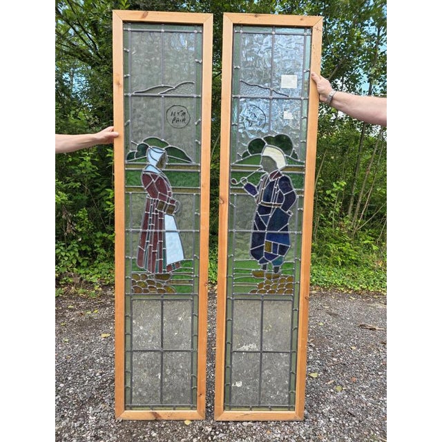 1930 antique leaded glass window with hand painted Dutch boy and girl design. The windows are in good used condition with...