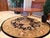 This Town and Country Centre Table has a top design that combines planked boards in a reverse diamond pattern. An...